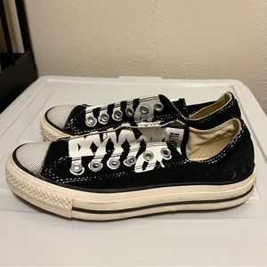 black converse slip on sneakers with graphic print painted laces